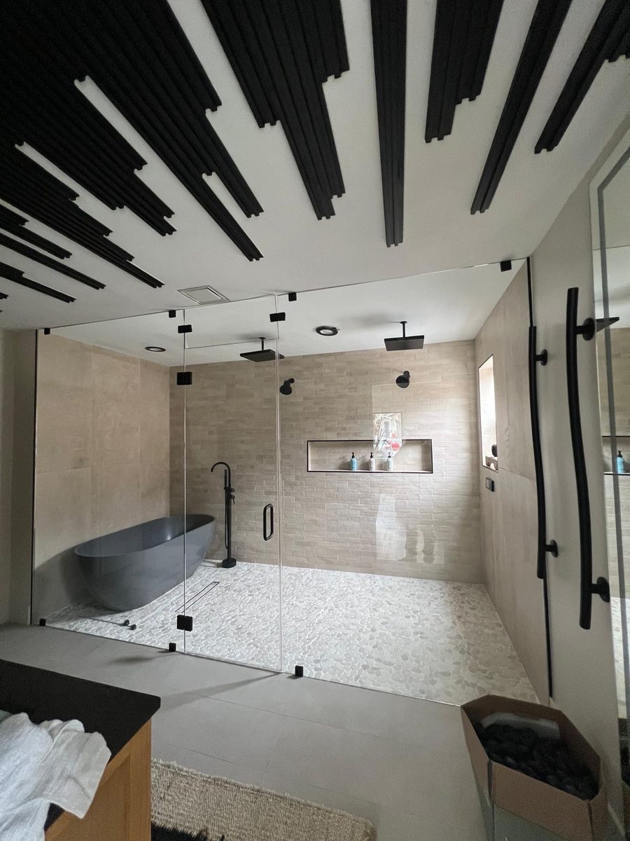 Spa bathroom with freestanding tub and slat ceiling