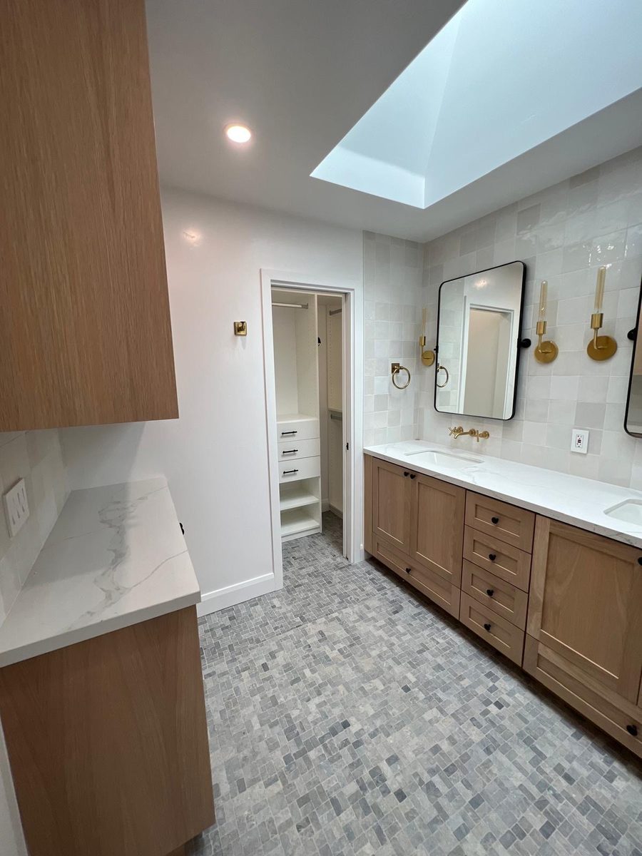 Skylit double vanity in white oak